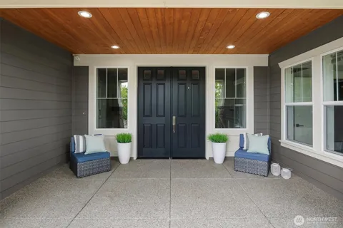 a living room with furniture and large window