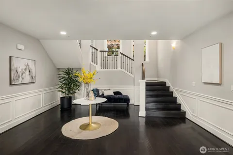 a lobby with furniture and wooden floor