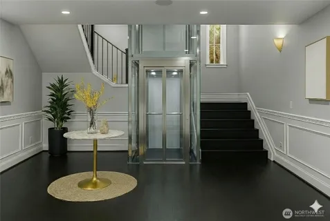 a view of entryway and hall with wooden floor