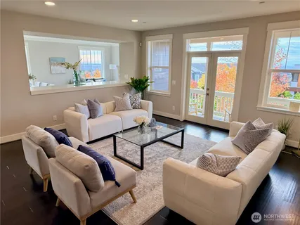 a living room with furniture and a large window