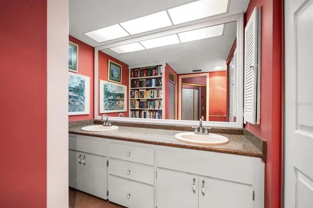 a bathroom with a sink and a window