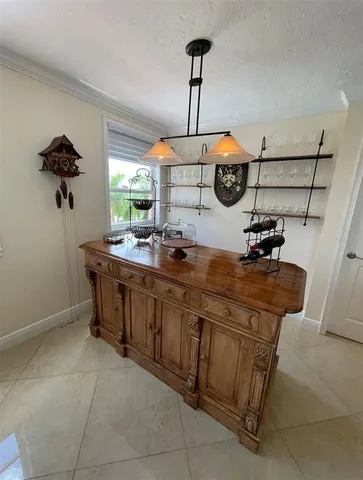 a kitchen with a sink and appliances