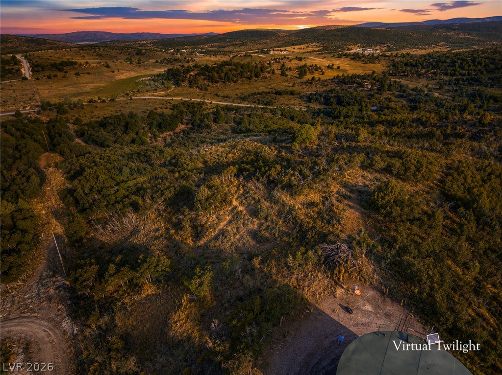 495 West Lutherwood Road Alton, UT 84710 - Photo 5 of 35 A vast, undulating landscape unfolds under a vibrant sunset, offering serene views and natural tranquility.