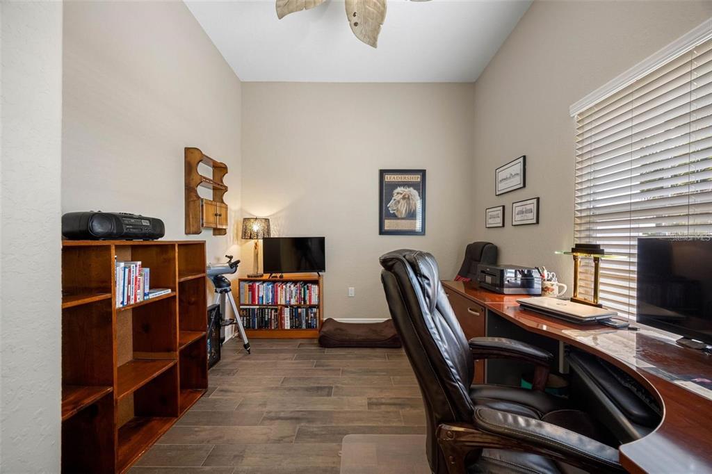 146 175th Terrace Drive East Redington Shores, FL 33708 - Photo 18 of 51 a view of a workspace with furniture and a window