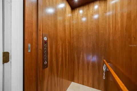 a bathroom with a double vanity sink a mirror and a bathtub