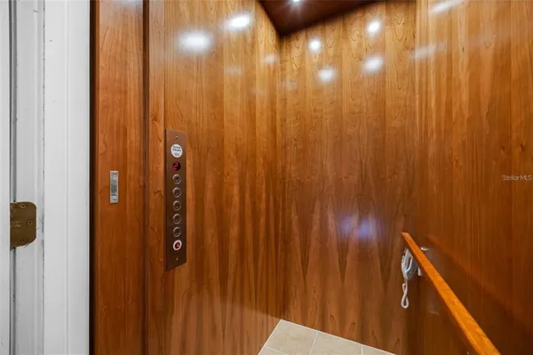 a bathroom with a double vanity sink a mirror and a bathtub