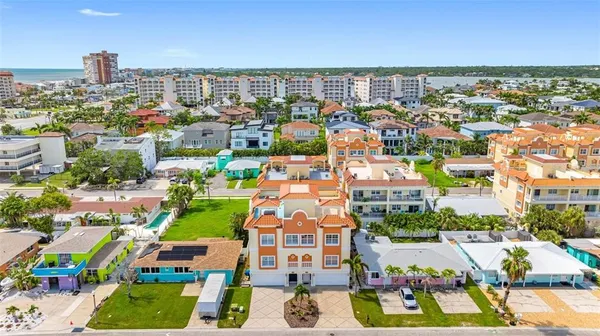 a view of multiple houses with yard