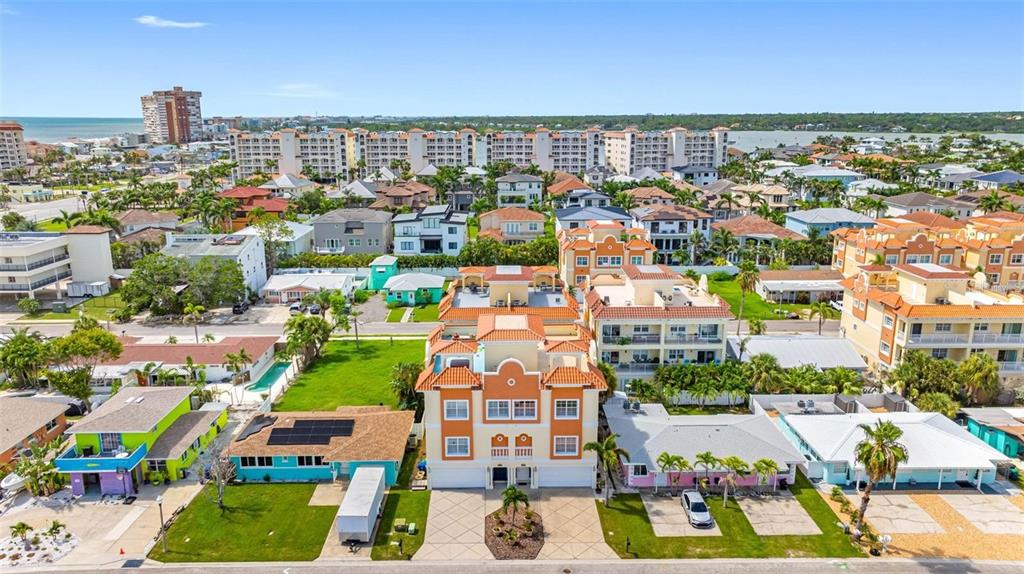 146 175th Terrace Drive East Redington Shores, FL 33708 - Photo 2 of 51 a view of multiple houses with yard