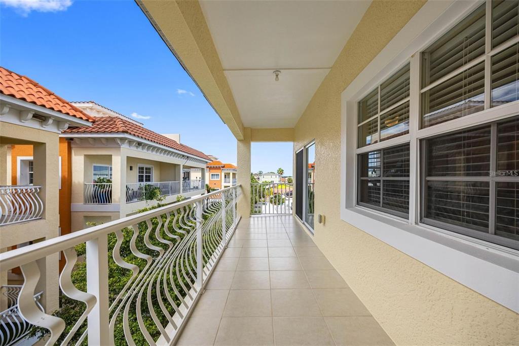 146 175th Terrace Drive East Redington Shores, FL 33708 - Photo 23 of 51 a view of balcony with an outdoor seating