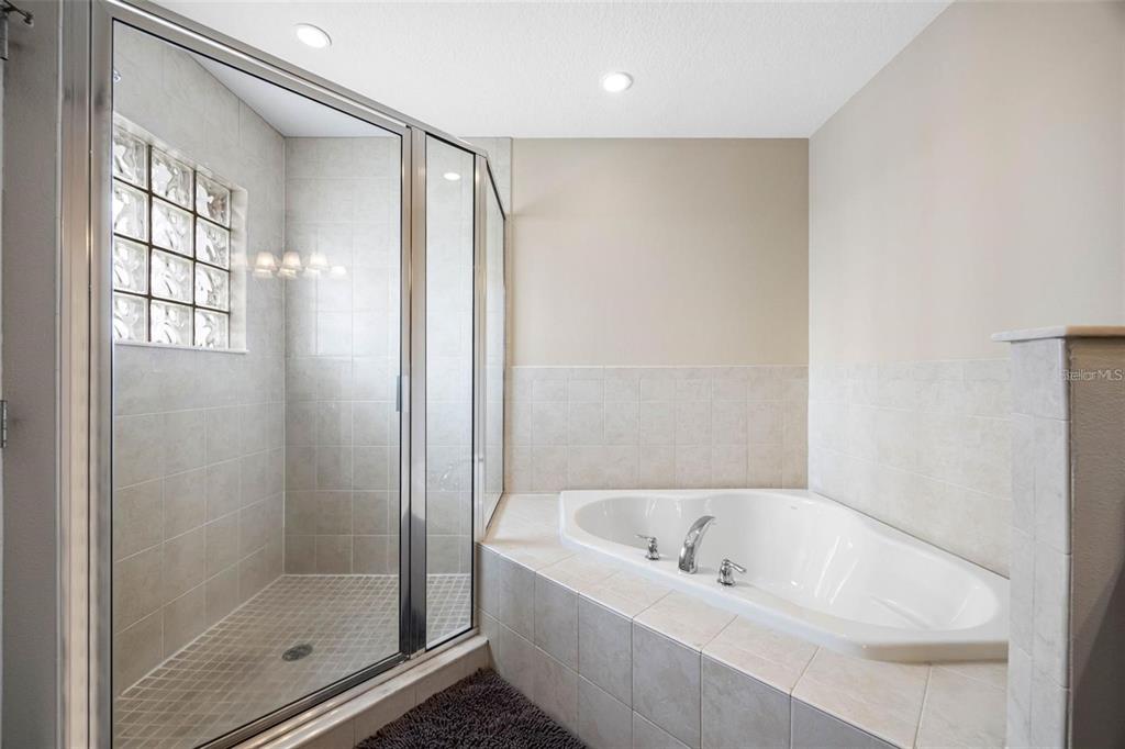 146 175th Terrace Drive East Redington Shores, FL 33708 - Photo 26 of 51 a bathroom with a bathtub and shower