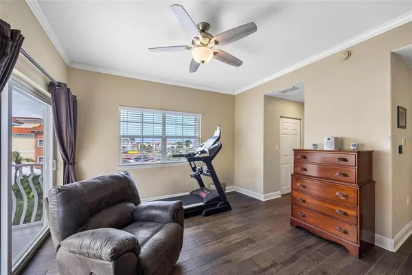 a view of living room with furniture and wooden floor