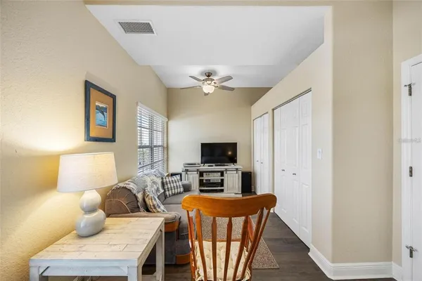 a bedroom with furniture and a wooden floor