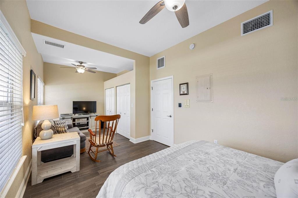 146 175th Terrace Drive East Redington Shores, FL 33708 - Photo 32 of 51 a bedroom with furniture and a wooden floor