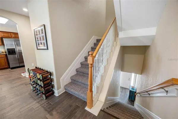 a living room with furniture a flat screen tv and a window