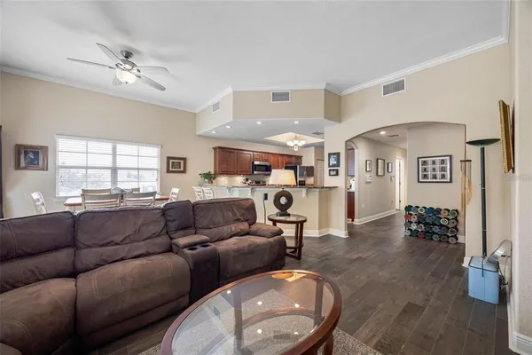 a dining room with furniture and wooden floor