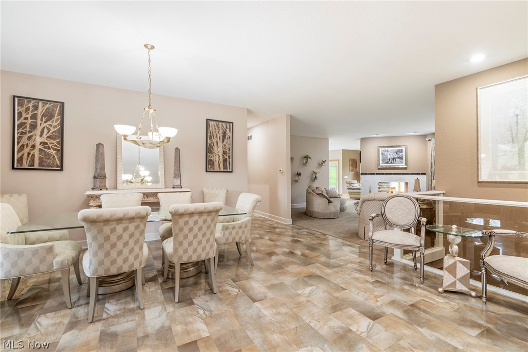 7435 South Raccoon Road Canfield, OH 44406 - Photo 14 of 47 Dining area featuring an inviting chandelier