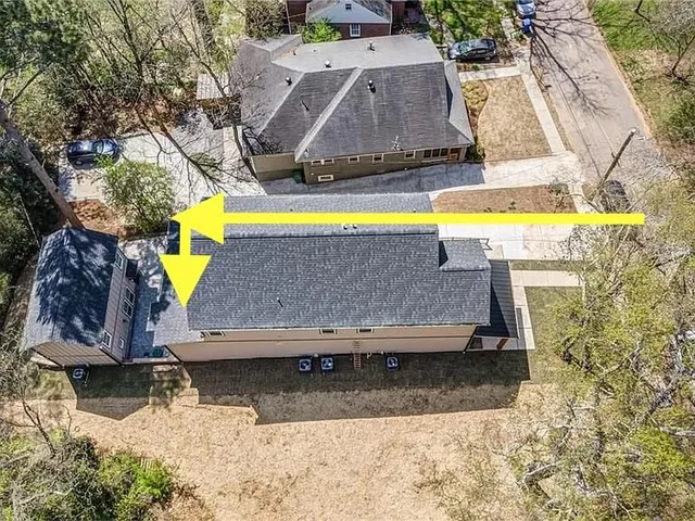 an aerial view of a house with swimming pool