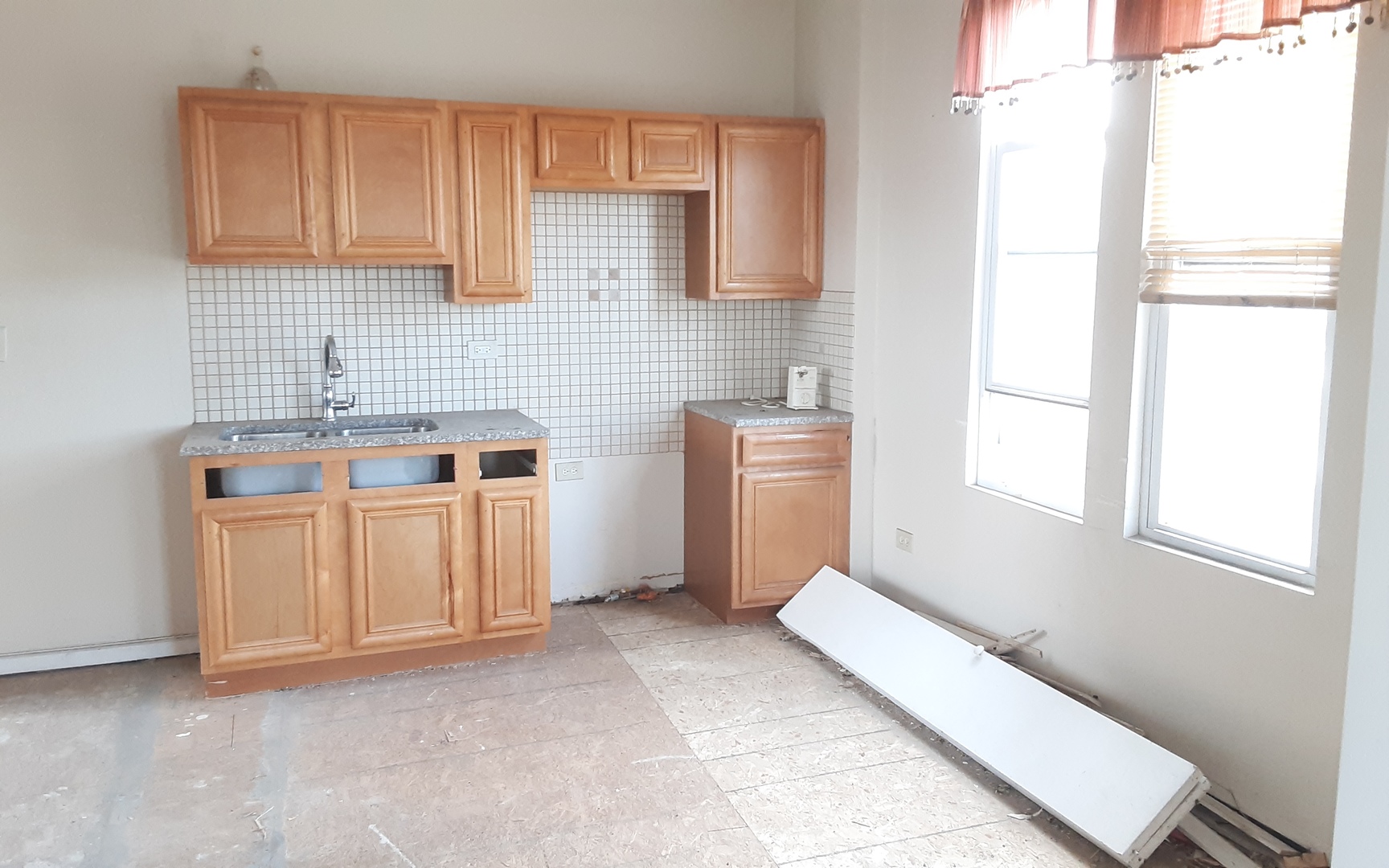 1222 St Charles Road Maywood, IL 60153 - Photo 10 of 13 a view of a kitchen with wooden cabinets