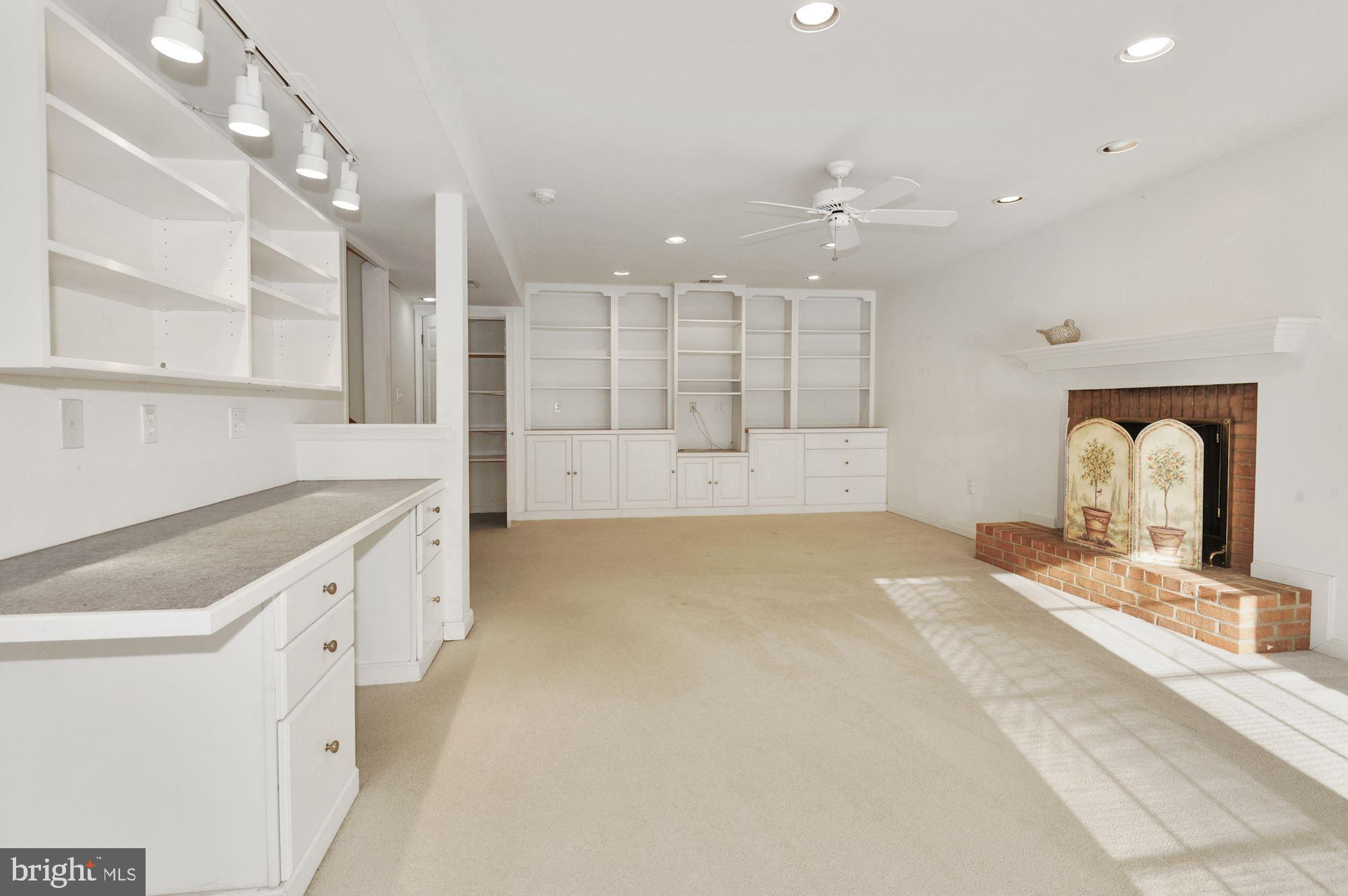 2101 Old Stage Road Alexandria, VA 22308 - Photo 35 of 45 Lower level family room + custom built in desk etc