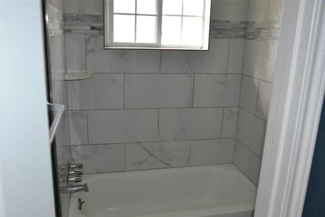 a bathroom with a bathtub