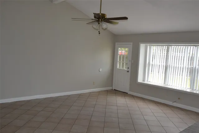 a view of an empty room with a window