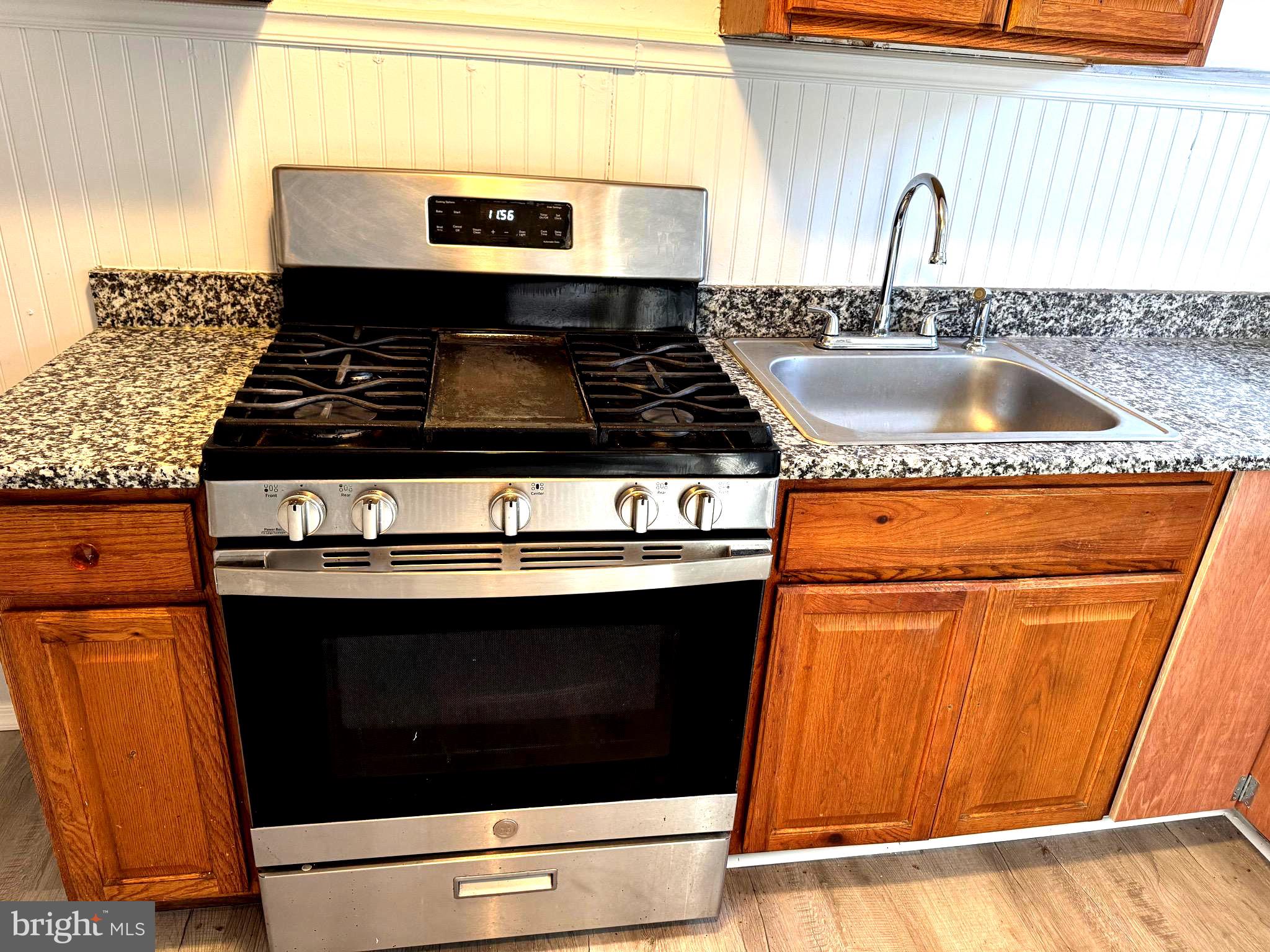 314 Copley Road Upper Darby, PA 19082 - Photo 7 of 11 a stove top oven sitting inside of a kitchen