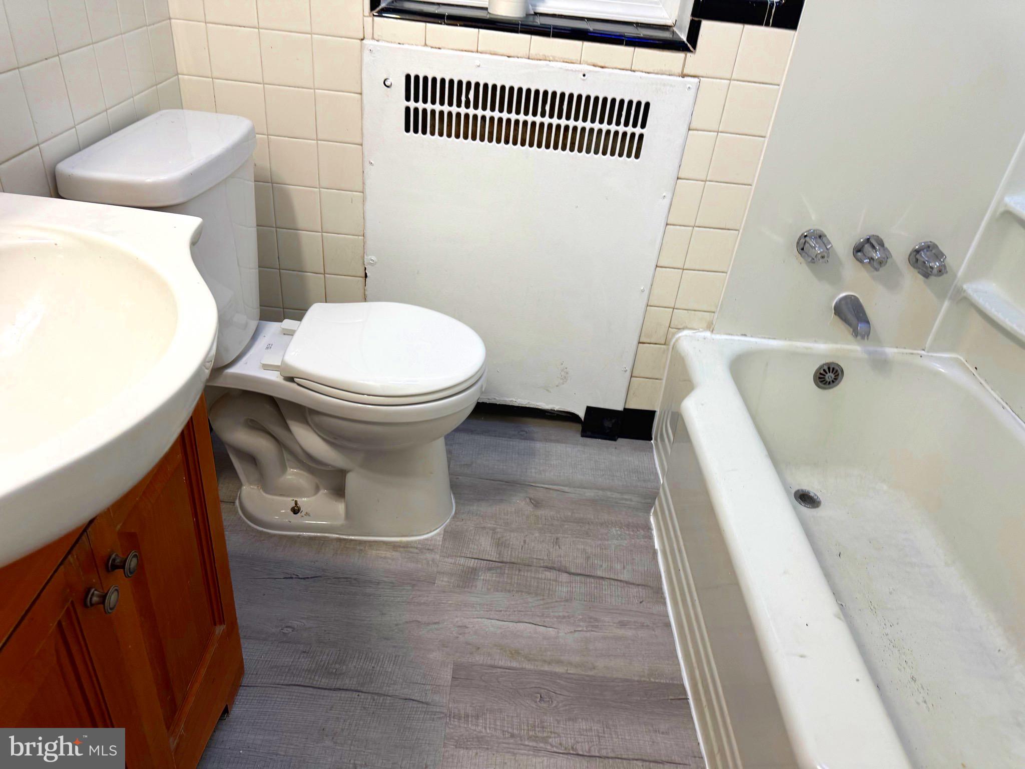 314 Copley Road Upper Darby, PA 19082 - Photo 10 of 11 a bathroom with a toilet and a bathtub