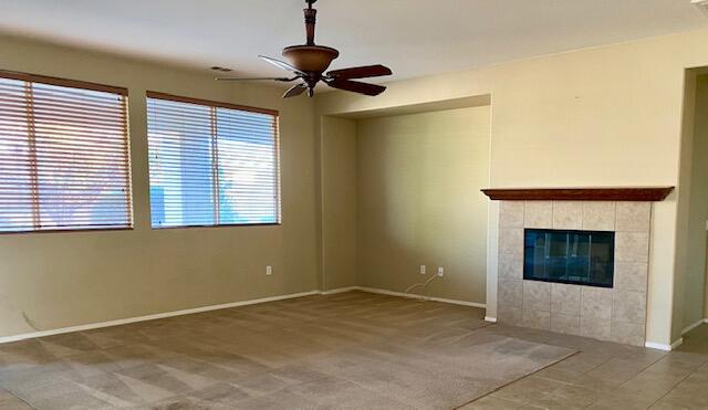 83346 Lone Star Road Indio, CA 92203 - Photo 3 of 12 a view of an empty room with a fireplace and a window