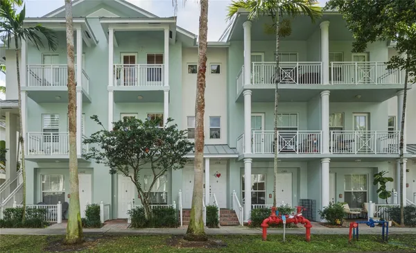 a front view of a building with garden