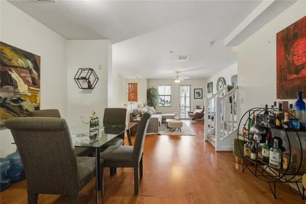 a view of a dining room with furniture and wooden floor