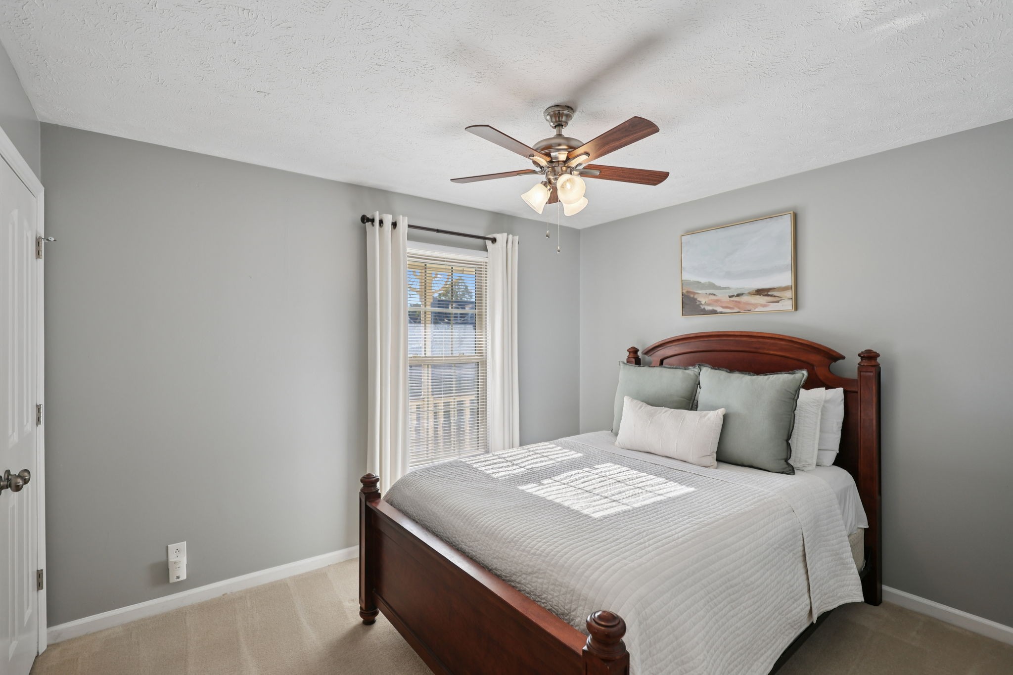 403 Acorn Court Smyrna, TN 37167 - Photo 19 of 34 a bedroom with a large bed and a chandelier