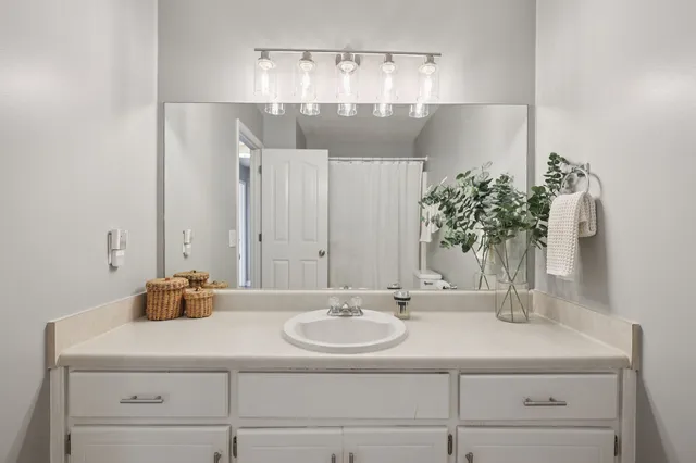 a bathroom with a sink and a mirror