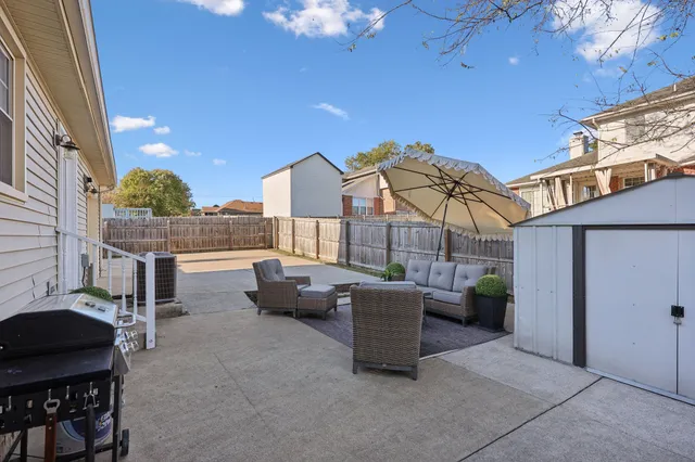 a view of a patio with couches and potted plants