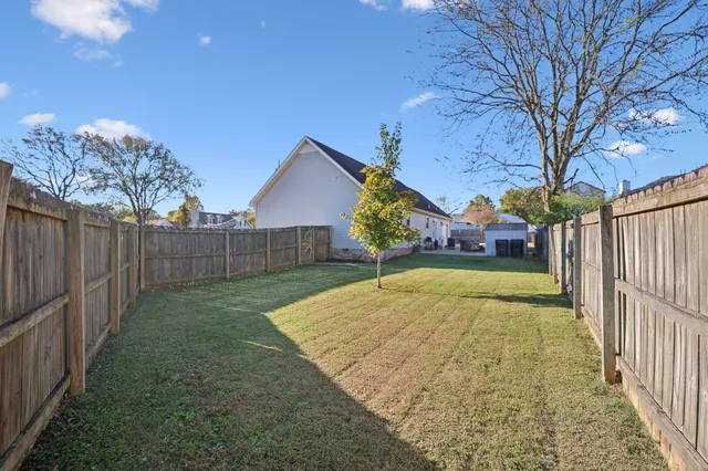 a view of backyard with swimming pool