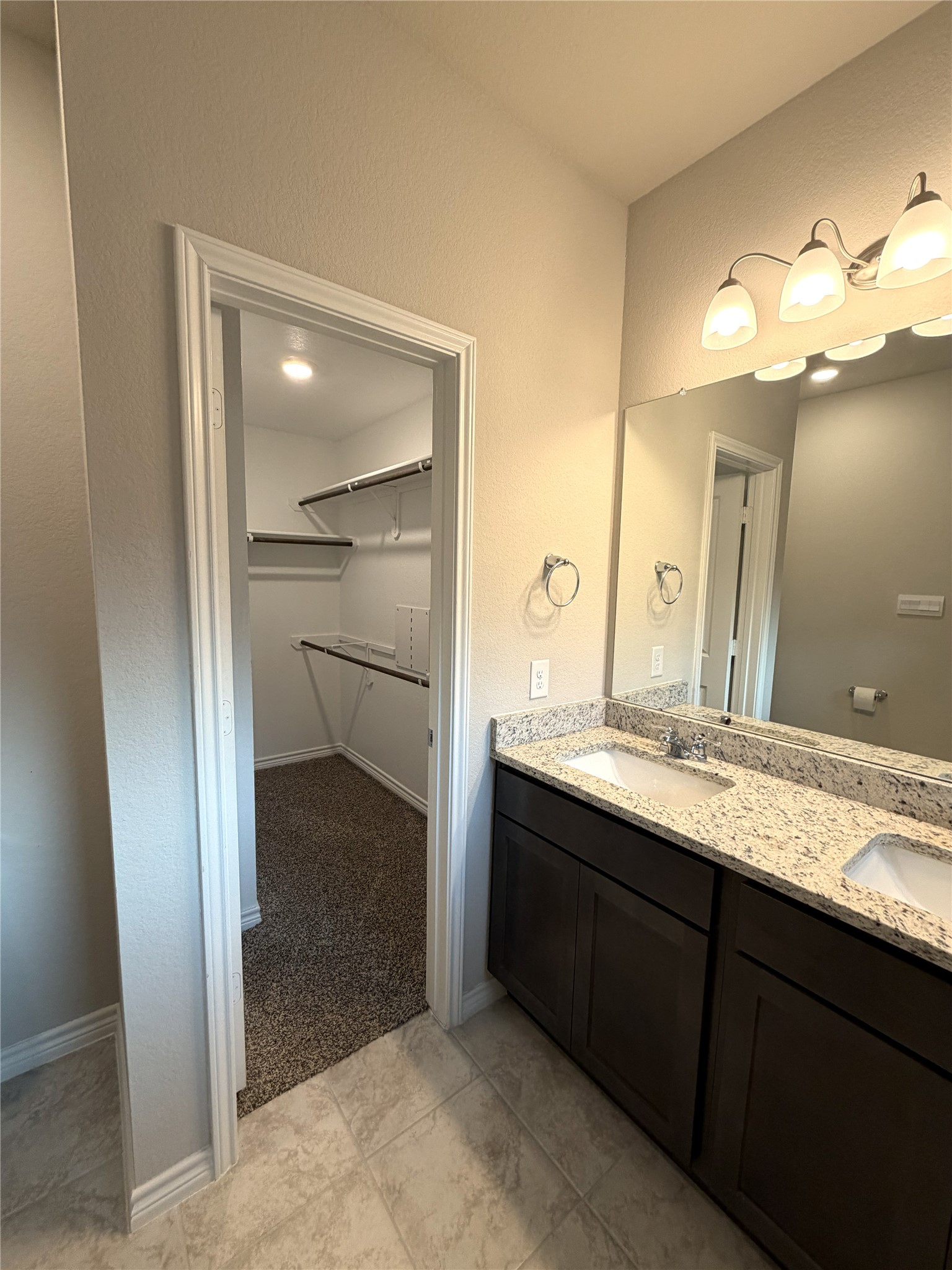 610 Legrand Street Brenham, TX 77833 - Photo 6 of 14 a bathroom with a granite countertop sink and a mirror