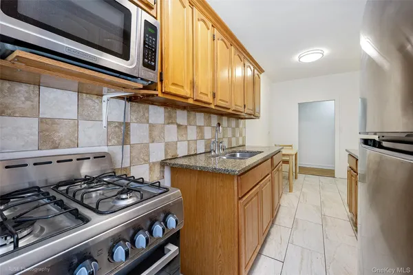 a kitchen with a stove and a sink