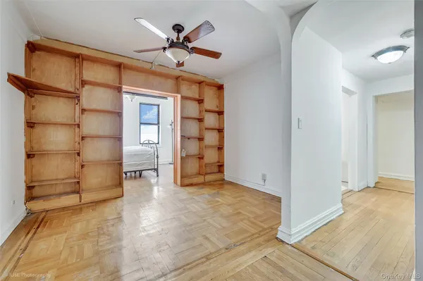 a view of an empty room with a cabinet