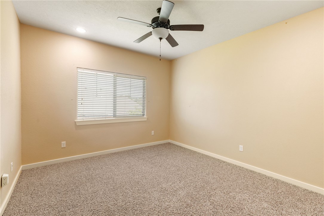 2136 Rockcliffe Loop College Station, TX 77845 - Photo 40 of 48 an empty room with windows and fan