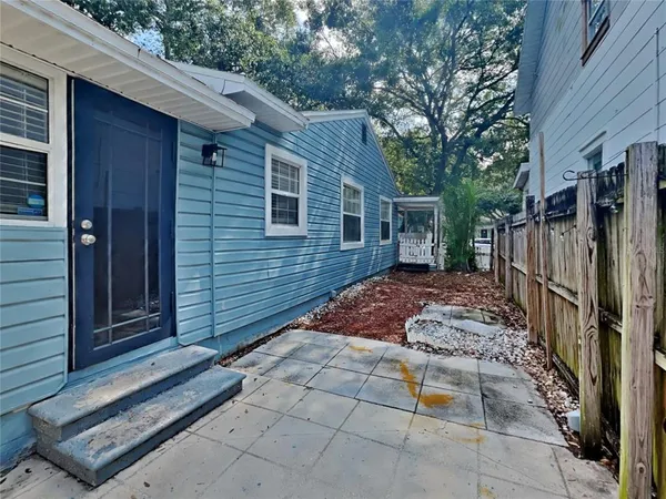 a backyard of a house with seating space