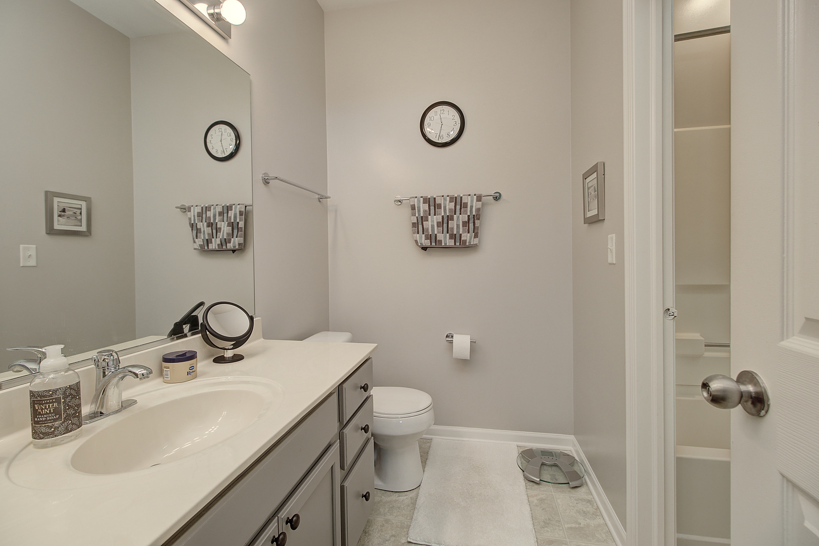 378 Reston Circle Romeoville, IL 60446 - Photo 10 of 17 a bathroom with a sink toilet and mirror
