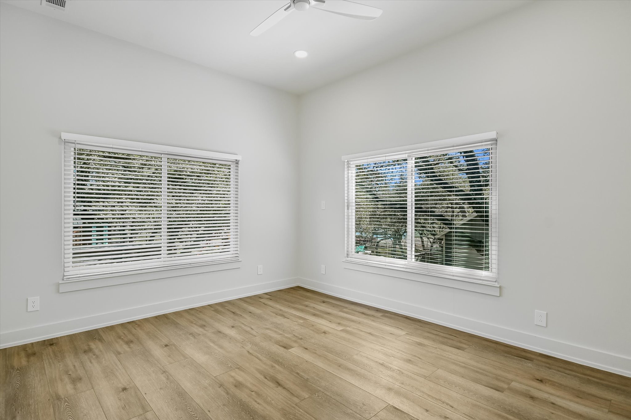 6111 Hudson Bend Road Austin, TX 78734 - Photo 34 of 40 Empty room with light wood-style flooring, ceiling fan, and recessed lighting