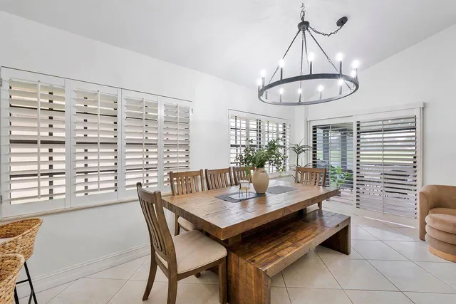 a spacious bathroom with a granite countertop sink mirror and bathtub