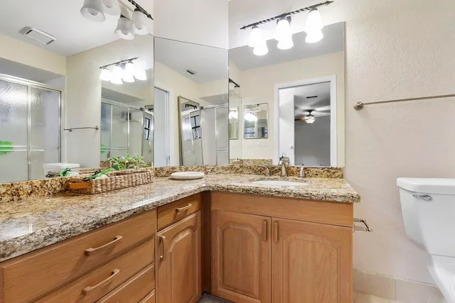 a view of a patio with furniture and a yard