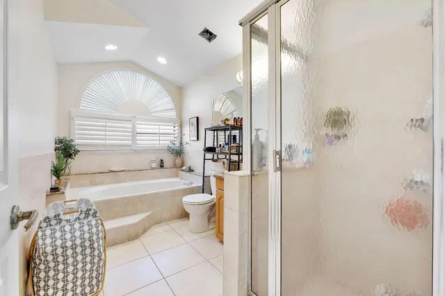 a living room with a large window and a floor to ceiling window