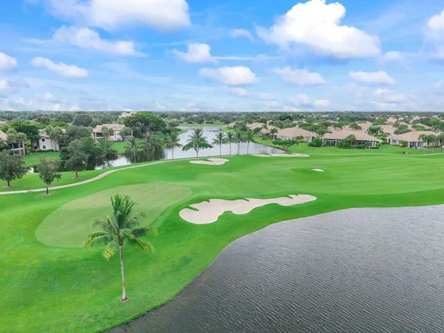 a swimming pool with outdoor seating and yard
