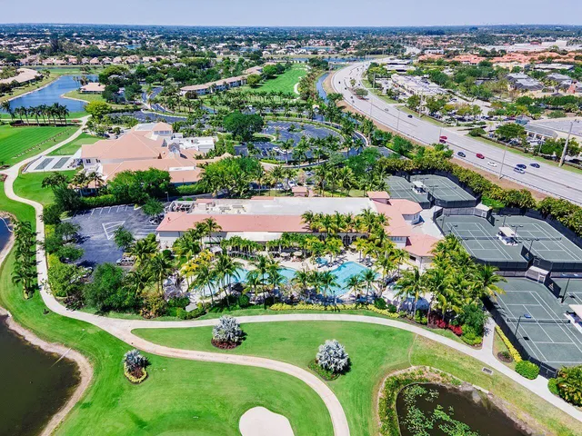 an aerial view of a house with a big yard