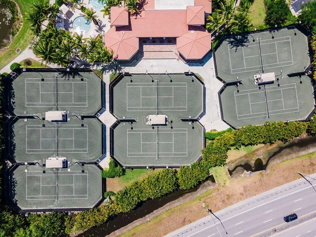 a view of a park with a palm trees