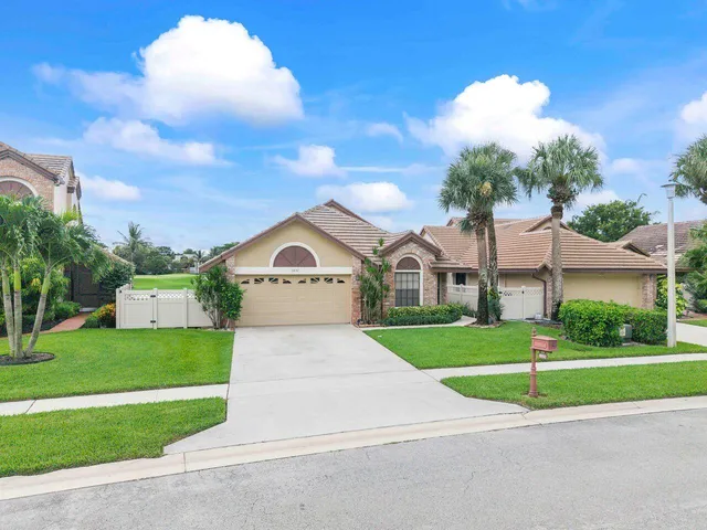an aerial view of a house with outdoor space lake view and lake view