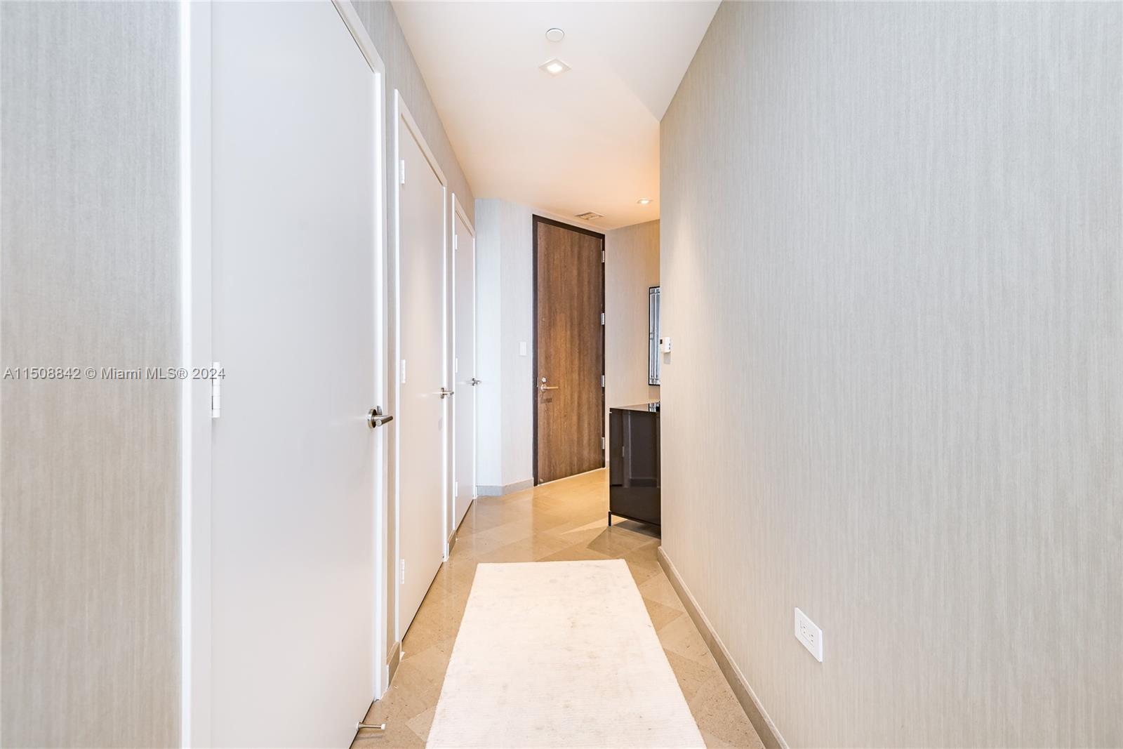 88 Southwest 7th Street, Unit 3301 Miami, FL 33130 - Photo 20 of 54 a view of a hallway with a white walls