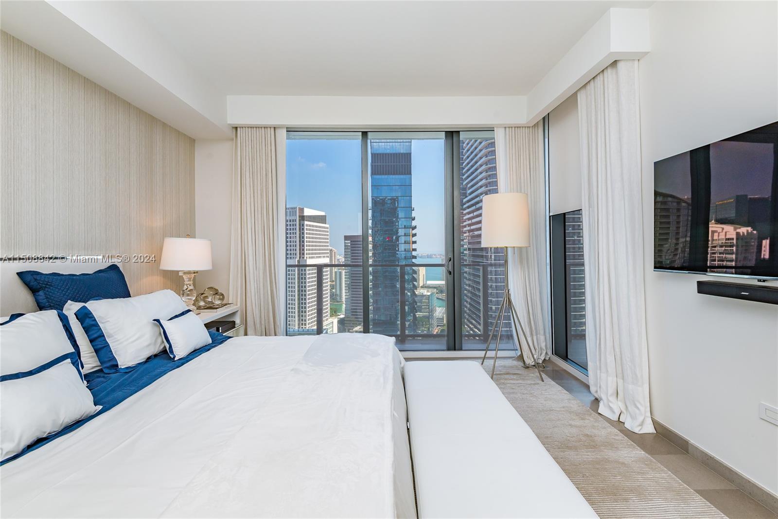 88 Southwest 7th Street, Unit 3301 Miami, FL 33130 - Photo 22 of 54 a bed room with a bed and a television